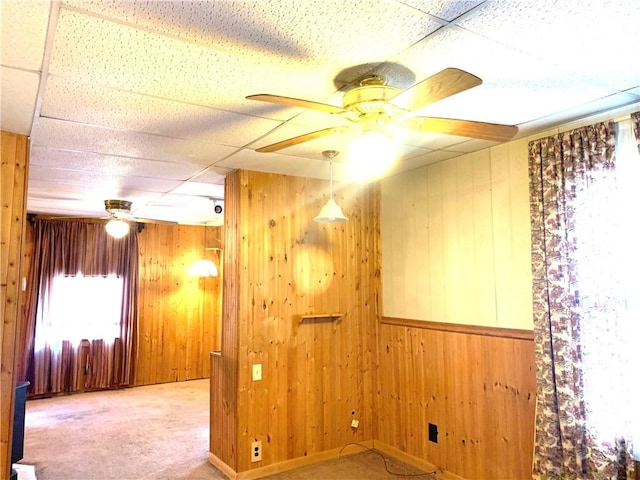 406 Peach St, City Of But Ne, PA 16001 - carpeted spare room featuring a ceiling fan, wooden walls, and a paneled ceiling