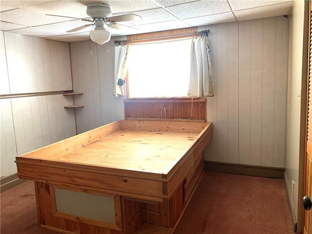 406 Peach St, City Of But Ne, PA 16001 - bathroom featuring ceiling fan, wooden walls, baseboards, and a drop ceiling