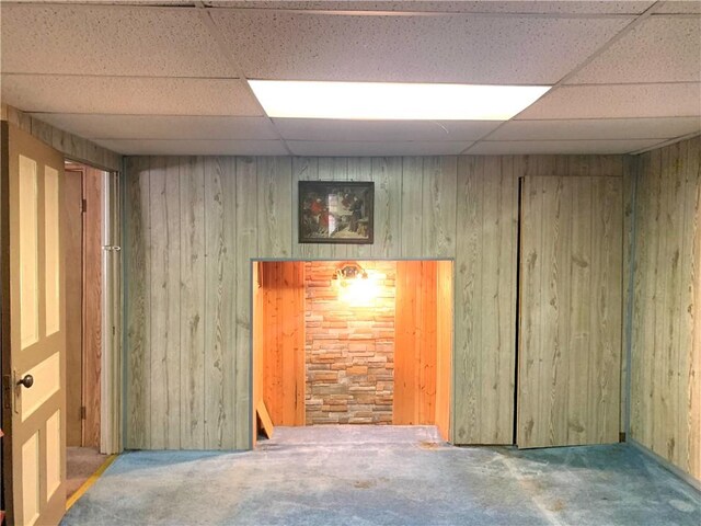 406 Peach St, City Of But Ne, PA 16001 - empty room with carpet floors, a drop ceiling, and wooden walls
