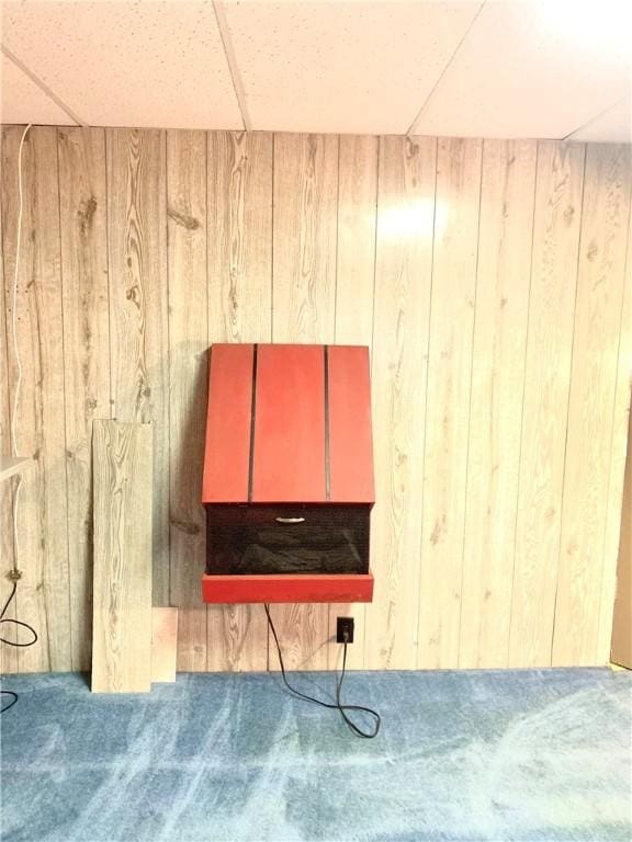406 Peach St, City Of But Ne, PA 16001 - detailed view of carpet flooring, wooden walls, and a drop ceiling