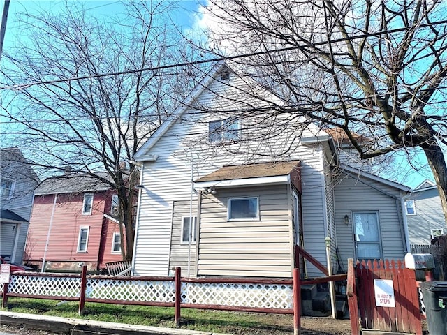 406 Peach St, City Of But Ne, PA 16001 - rear view of property featuring entry steps and fence