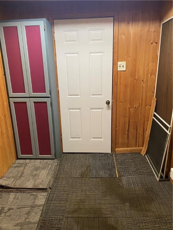 406 Peach St, City Of But Ne, PA 16001 - doorway to outside featuring wood walls and carpet floors
