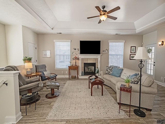 232 Adams Pointe Blvd Unit 6, Adams Twp, PA 16046 - living area featuring a raised ceiling, wood finished floors, a ceiling fan, and healthy amount of natural light