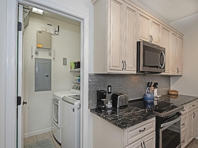 232 Adams Pointe Blvd Unit 6, Adams Twp, PA 16046 - kitchen with appliances with stainless steel finishes, electric panel, washing machine and dryer, decorative backsplash, and baseboards