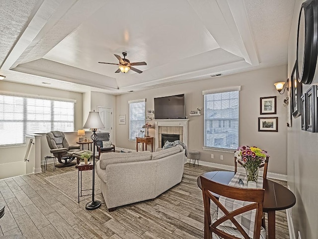 232 Adams Pointe Blvd Unit 6, Adams Twp, PA 16046 - living room with a raised ceiling, baseboards, wood finished floors, and plenty of natural light