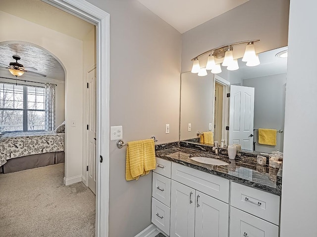 232 Adams Pointe Blvd Unit 6, Adams Twp, PA 16046 - bathroom featuring ensuite bath, vanity, a ceiling fan, and baseboards