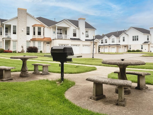 232 Adams Pointe Blvd Unit 6, Adams Twp, PA 16046 - surrounding community featuring a residential view, an attached garage, a yard, and driveway