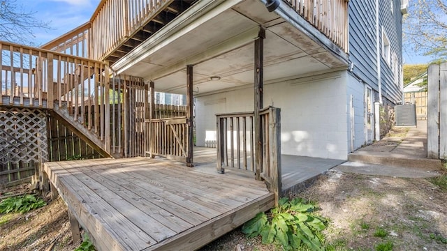 wooden terrace with fence and stairs