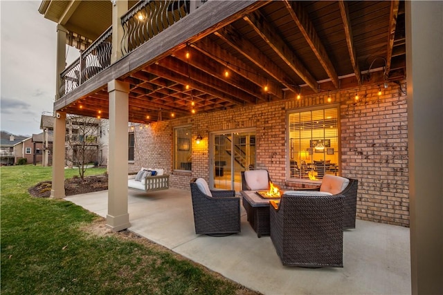 view of patio / terrace featuring an outdoor living space with a fire pit