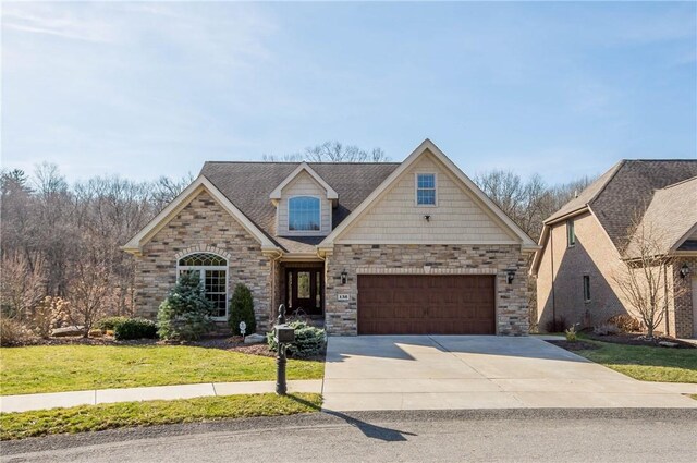 view of front of property featuring a garage, stone siding, concrete driveway, and a front lawn