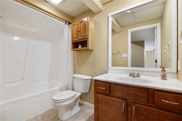 bathroom with tile patterned floors, shower / bath combo with shower curtain, toilet, and vanity