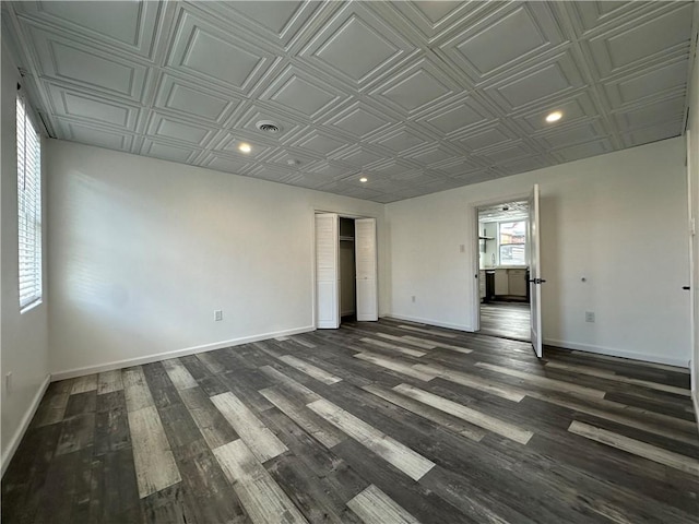 unfurnished room with recessed lighting, baseboards, and an ornate ceiling