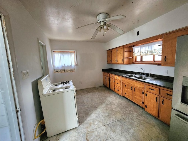 26 W Terrace Ave, New Castle/8Th, PA 16102 - kitchen featuring dark countertops, a sink, washer / dryer, brown cabinets, and open shelves