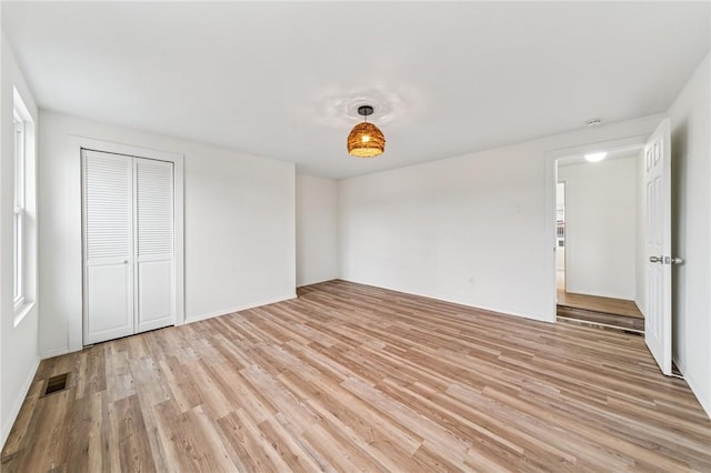 5021 Broad St, Garfield, PA 15224 - unfurnished bedroom featuring light wood-type flooring and a closet