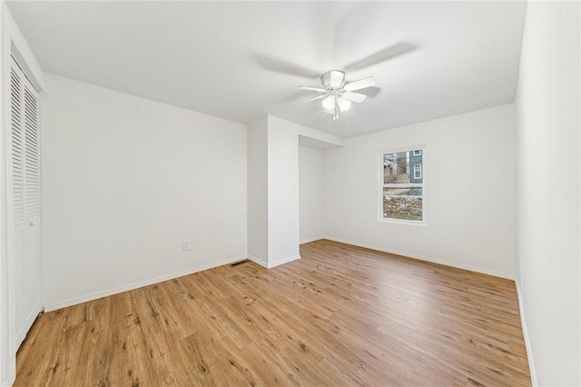 5021 Broad St, Garfield, PA 15224 - unfurnished bedroom featuring light wood-type flooring, a closet, and a ceiling fan