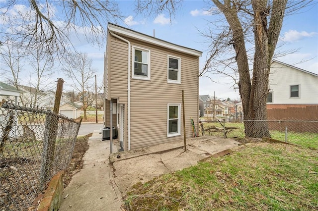 5021 Broad St, Garfield, PA 15224 - rear view of house with a fenced backyard and a patio area