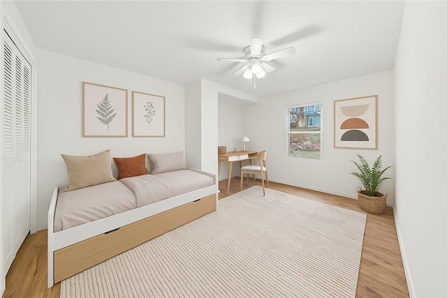 5021 Broad St, Garfield, PA 15224 - bedroom with light wood-type flooring, an office area, a closet, and a ceiling fan