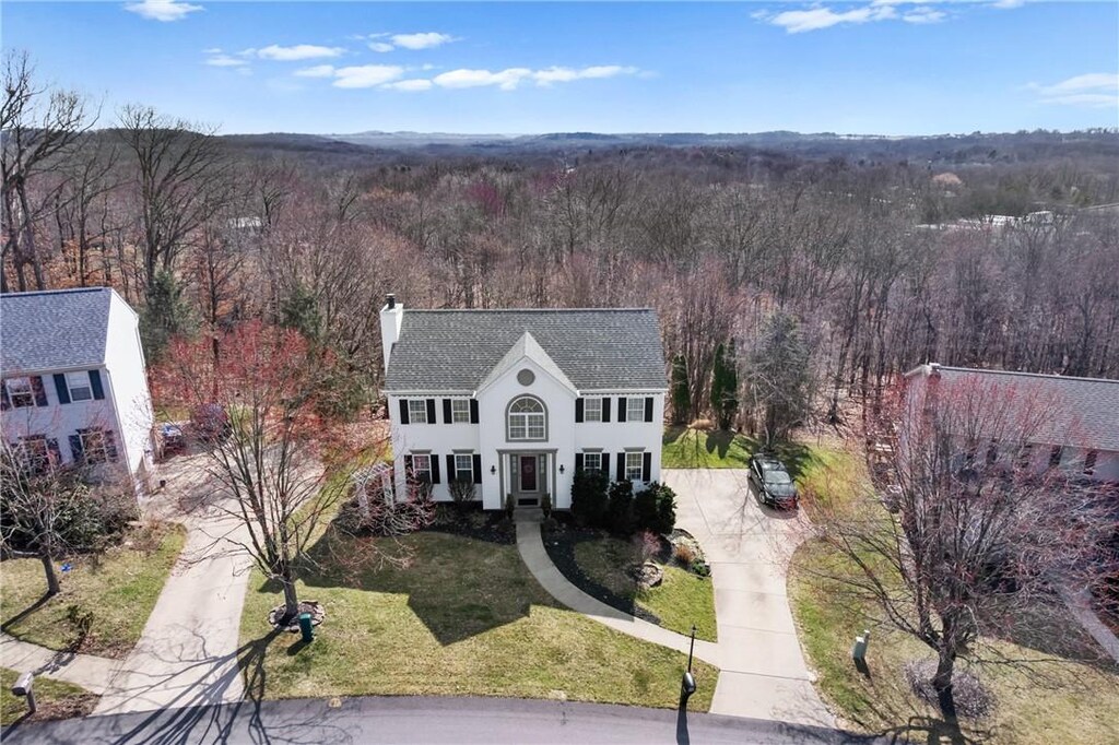 bird's eye view featuring a view of trees