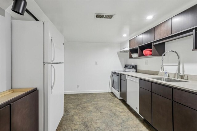 621 Butler St, Etna, PA 15223 - kitchen featuring white appliances, visible vents, a sink, light countertops, and dark brown cabinets