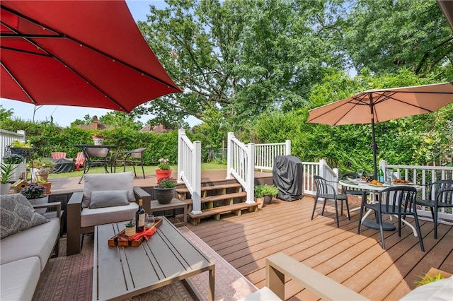 deck with outdoor dining space and an outdoor hangout area