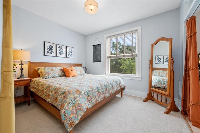 bedroom featuring carpet flooring and baseboards