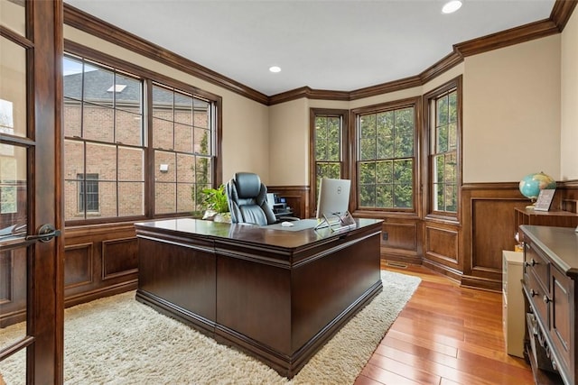 home office with light wood finished floors, recessed lighting, wainscoting, and crown molding