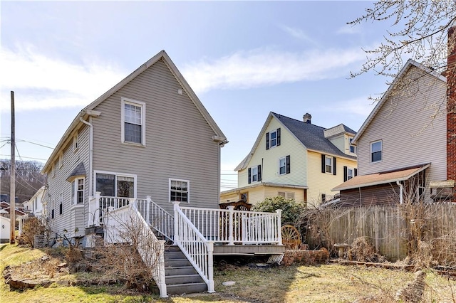 rear view of house with a wooden deck