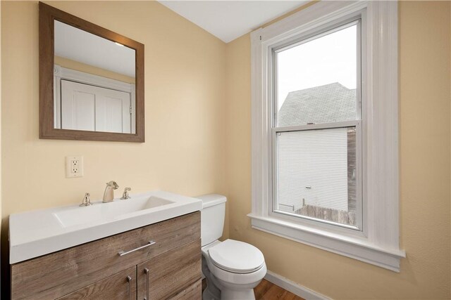 157-159 Grant Ave, Verona, PA 15147 - half bathroom featuring plenty of natural light, toilet, and vanity
