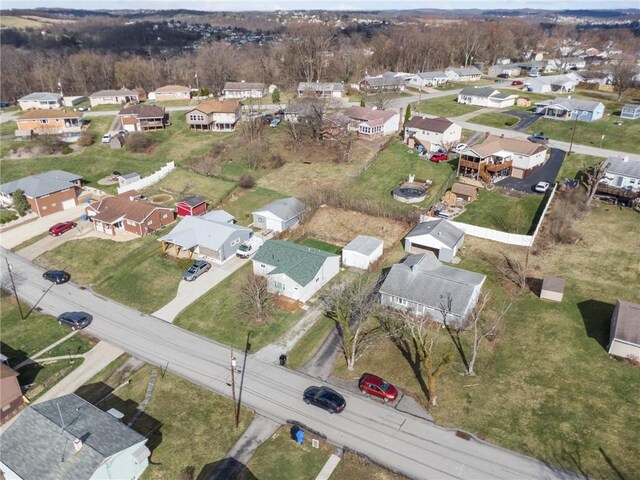 birds eye view of property with a residential view
