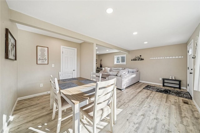 dining room featuring recessed lighting, baseboards, and light wood-style flooring