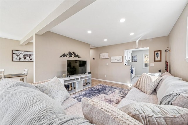 living area featuring recessed lighting, baseboards, and wood finished floors