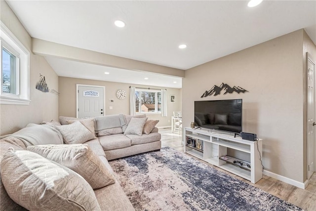 living area with recessed lighting, wood finished floors, and baseboards