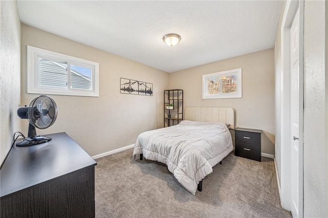 bedroom with carpet flooring and baseboards