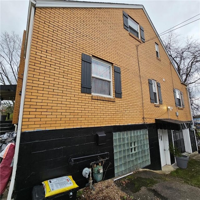 view of home's exterior with brick siding