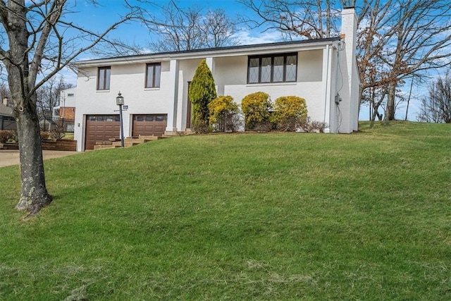 1693 Emery Dr, Mccandless, PA 15101 - view of front of house featuring a chimney, an attached garage, concrete driveway, and a front yard