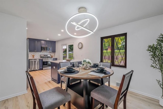 1693 Emery Dr, Mccandless, PA 15101 - dining area with light wood finished floors, a chandelier, baseboards, and recessed lighting