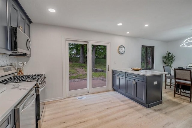 1693 Emery Dr, Mccandless, PA 15101 - kitchen featuring stainless steel appliances, light wood-style flooring, a peninsula, recessed lighting, and backsplash