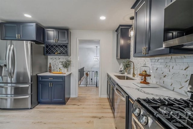 1693 Emery Dr, Mccandless, PA 15101 - kitchen with stainless steel appliances, a sink, exhaust hood, tasteful backsplash, and recessed lighting