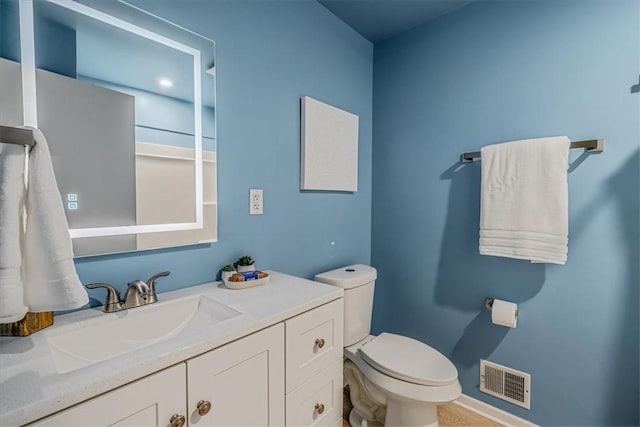 1693 Emery Dr, Mccandless, PA 15101 - bathroom with toilet, vanity, and baseboards