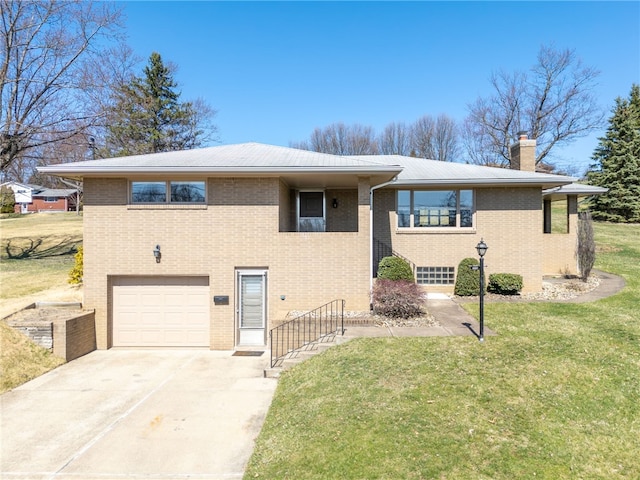 view of front of house featuring a garage, a front yard, brick siding, and a chimney