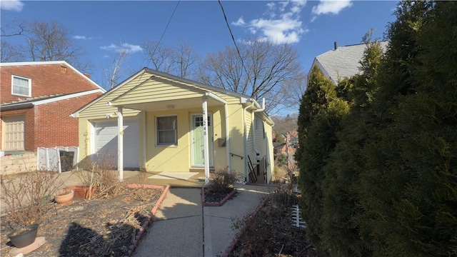 248 Spruceton Ave, Mt Lebanon, PA 15228 - view of front facade featuring brick siding, a porch, and an attached garage