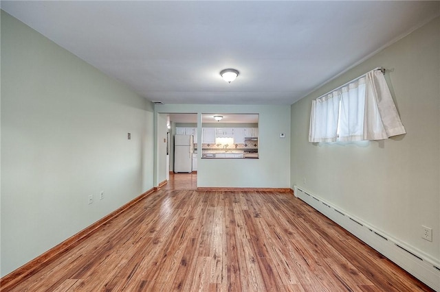 248 Spruceton Ave, Mt Lebanon, PA 15228 - interior space with light wood-style floors, a baseboard radiator, and baseboards