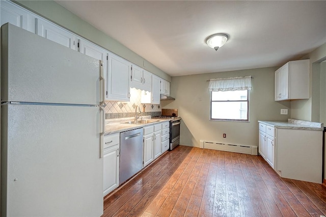 248 Spruceton Ave, Mt Lebanon, PA 15228 - kitchen featuring tasteful backsplash, hardwood / wood-style floors, a baseboard heating unit, light countertops, and stainless steel appliances