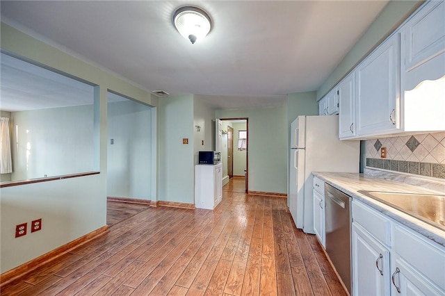 248 Spruceton Ave, Mt Lebanon, PA 15228 - kitchen featuring tasteful backsplash, white cabinets, visible vents, dishwasher, and wood finished floors