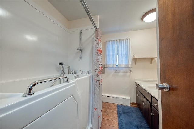 248 Spruceton Ave, Mt Lebanon, PA 15228 - full bathroom featuring a tub, vanity, a shower with curtain, wood finished floors, and a baseboard heating unit
