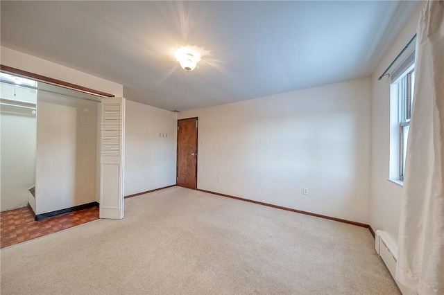 248 Spruceton Ave, Mt Lebanon, PA 15228 - unfurnished bedroom with light carpet, baseboards, multiple windows, and a closet