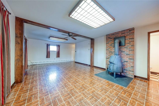 248 Spruceton Ave, Mt Lebanon, PA 15228 - empty room with a wood stove, baseboard heating, baseboards, and brick patterned floor