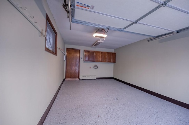 248 Spruceton Ave, Mt Lebanon, PA 15228 - garage featuring baseboards, a baseboard radiator, and a garage door opener
