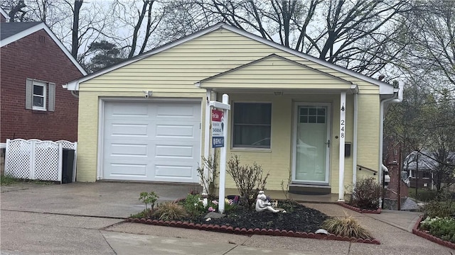 248 Spruceton Ave, Mt Lebanon, PA 15228 - view of front facade featuring an attached garage and concrete driveway