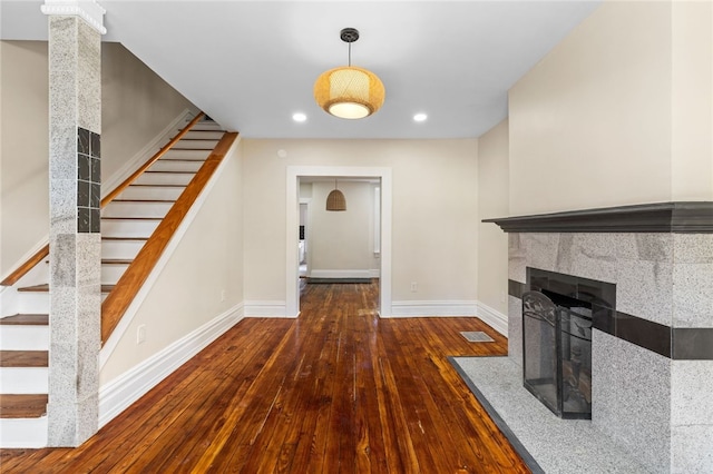 927 Greenfield Ave, Greenfield, PA 15217 - unfurnished living room with stairs, hardwood / wood-style flooring, recessed lighting, and baseboards